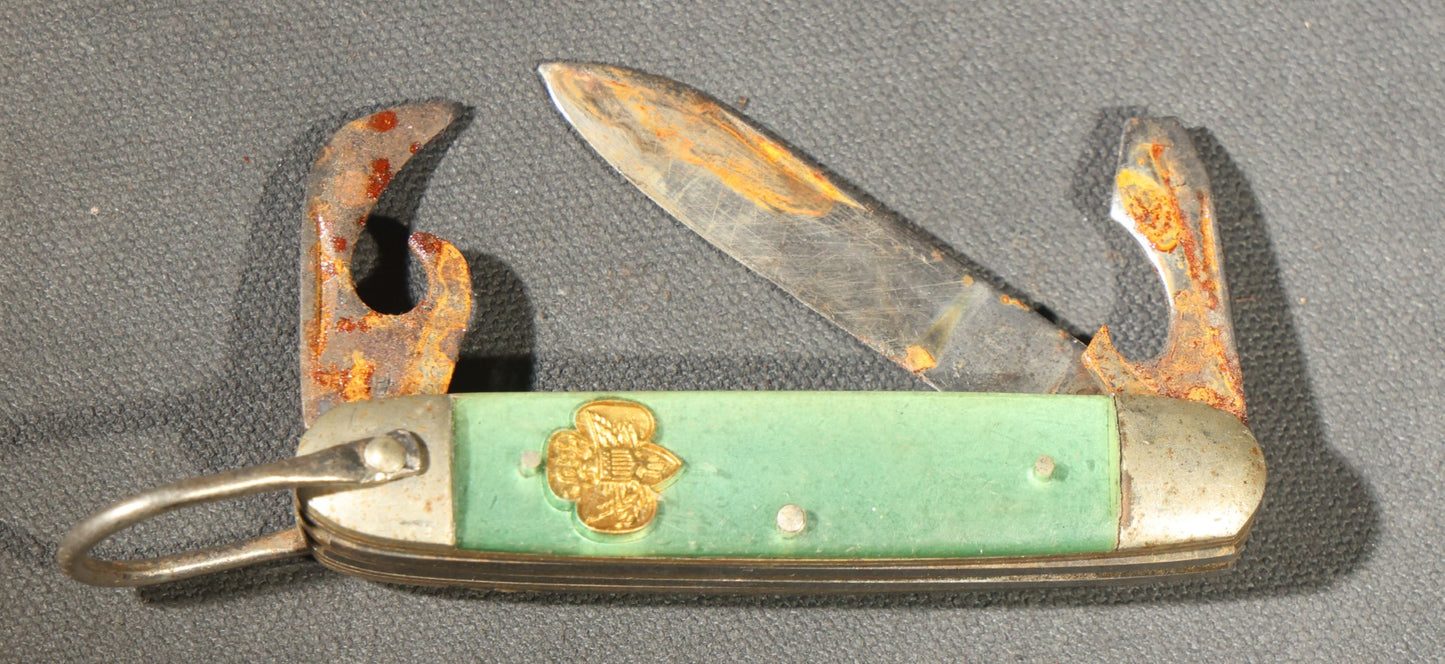 Grouping of Seven Vintage Folding Pocket Knives Including Multi-Tool Camp Knives, Stockman, and Trapper Styles with Bone, Jigged, and Composite Handles