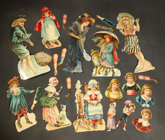 Grouping of 14 Antique Chromolithograph Paper Dolls with Extra Limbs and Accessories Including Raphael Tuck and Sons, Little Red Riding Hood, and Spinning Wheel Figures
