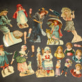 Lot 095 - Grouping of 14 Antique Chromolithograph Paper Dolls with Extra Limbs and Accessories Including Raphael Tuck and Sons, Little Red Riding Hood, and Spinning Wheel Figures