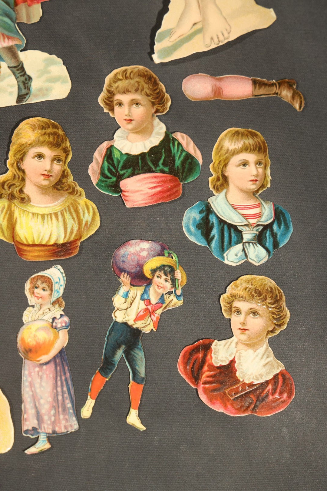 Grouping of 14 Antique Chromolithograph Paper Dolls with Extra Limbs and Accessories Including Raphael Tuck and Sons, Little Red Riding Hood, and Spinning Wheel Figures