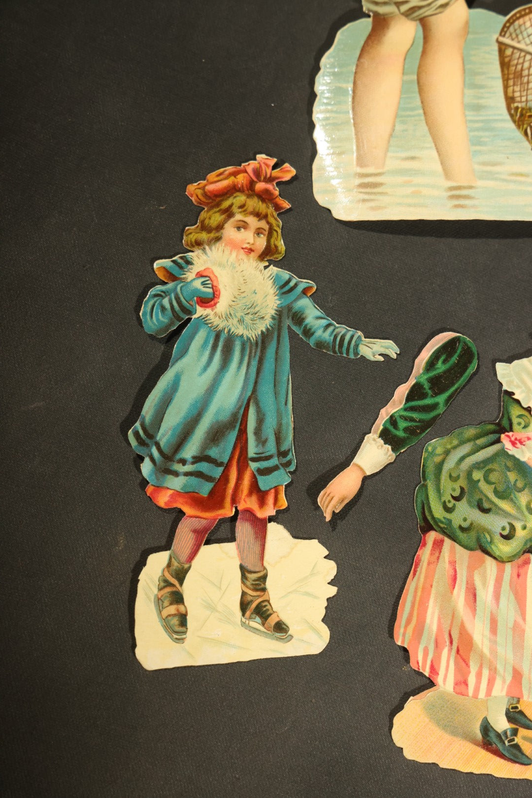 Grouping of 14 Antique Chromolithograph Paper Dolls with Extra Limbs and Accessories Including Raphael Tuck and Sons, Little Red Riding Hood, and Spinning Wheel Figures