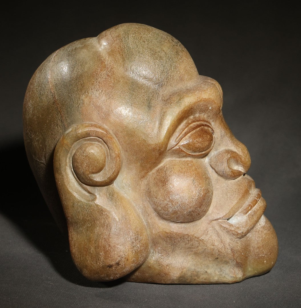 Vintage Carved Stone Grotesque Head with Exaggerated Features and Spiral Ears