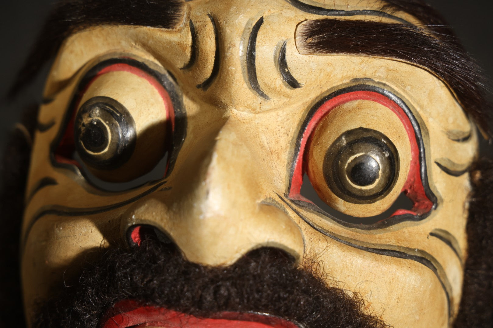 Vintage Carved and Painted Balinese Topeng-Style Wood Mask with Bulging Eyes, Mustache, Hair, and Red Earrings