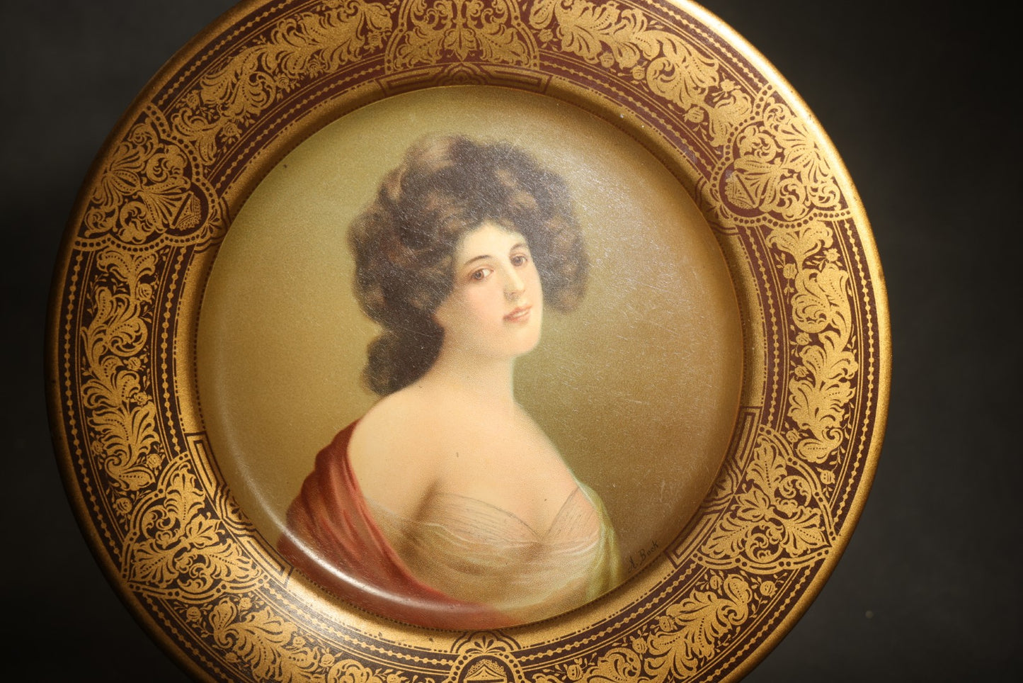 Antique Vienna Art Plates Tin Lithograph Portrait Plate, Young Woman in a Red Drape, Gilt Arabesque Border, Patented February 21, 1905