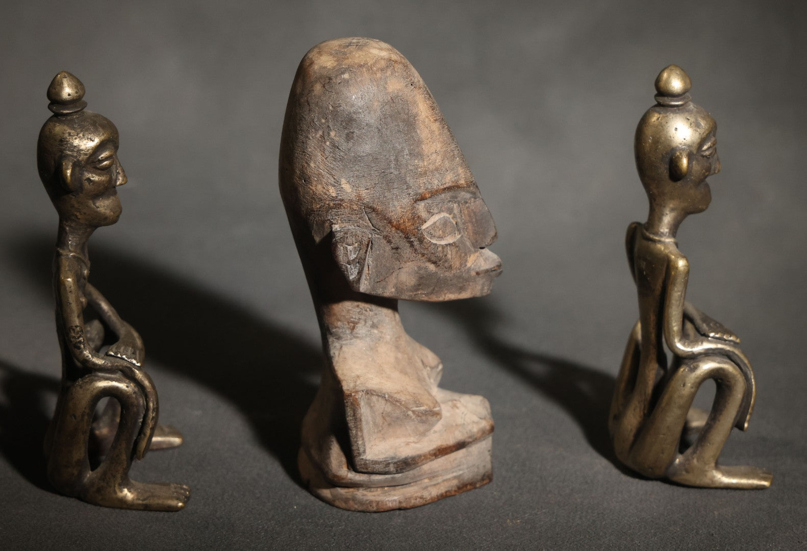 Trio of Vintage African-Style Metal and Wood Figures Including Two Seated Metal Figures and One Carved Wood Bust