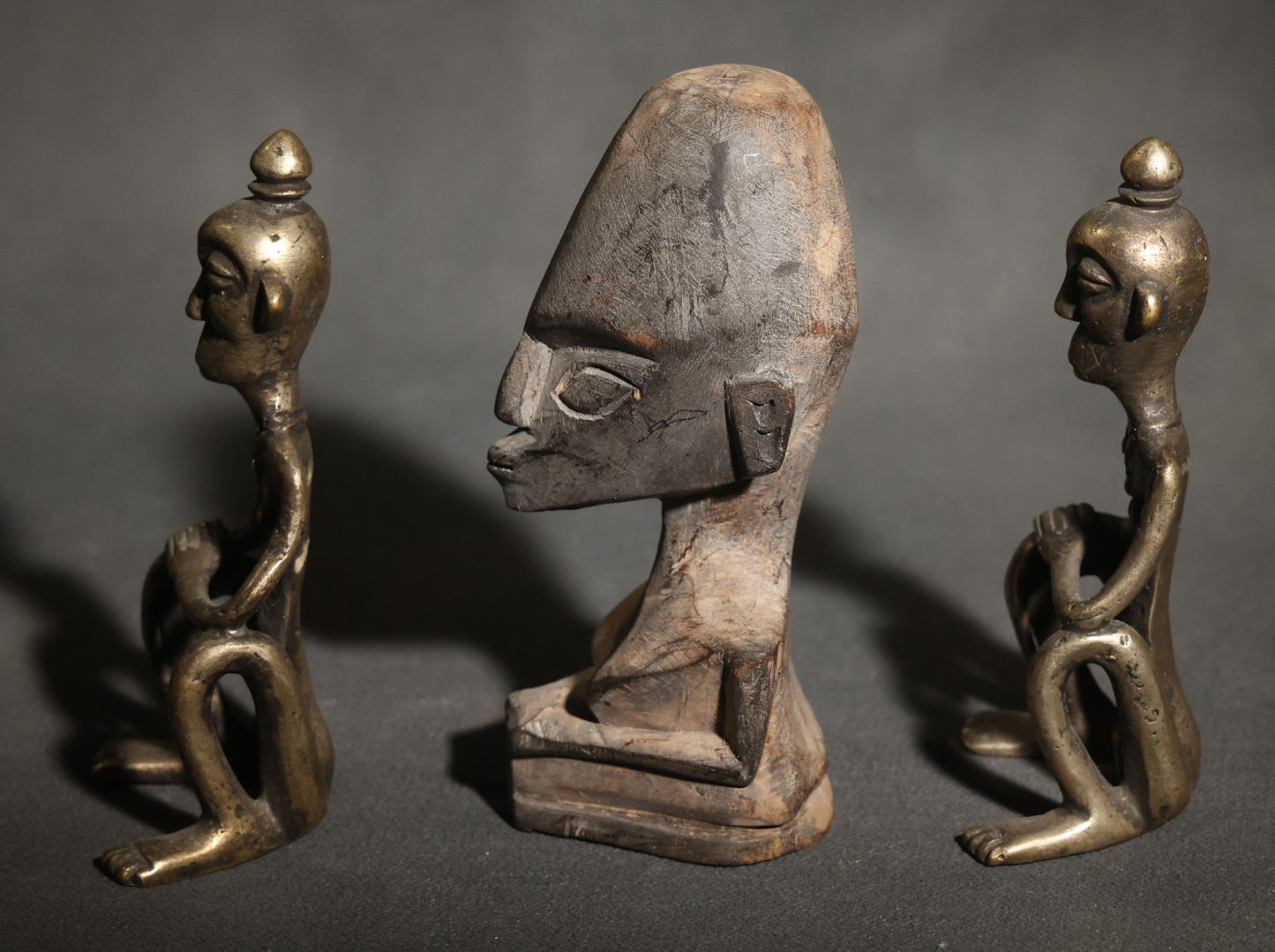 Trio of Vintage African-Style Metal and Wood Figures Including Two Seated Metal Figures and One Carved Wood Bust