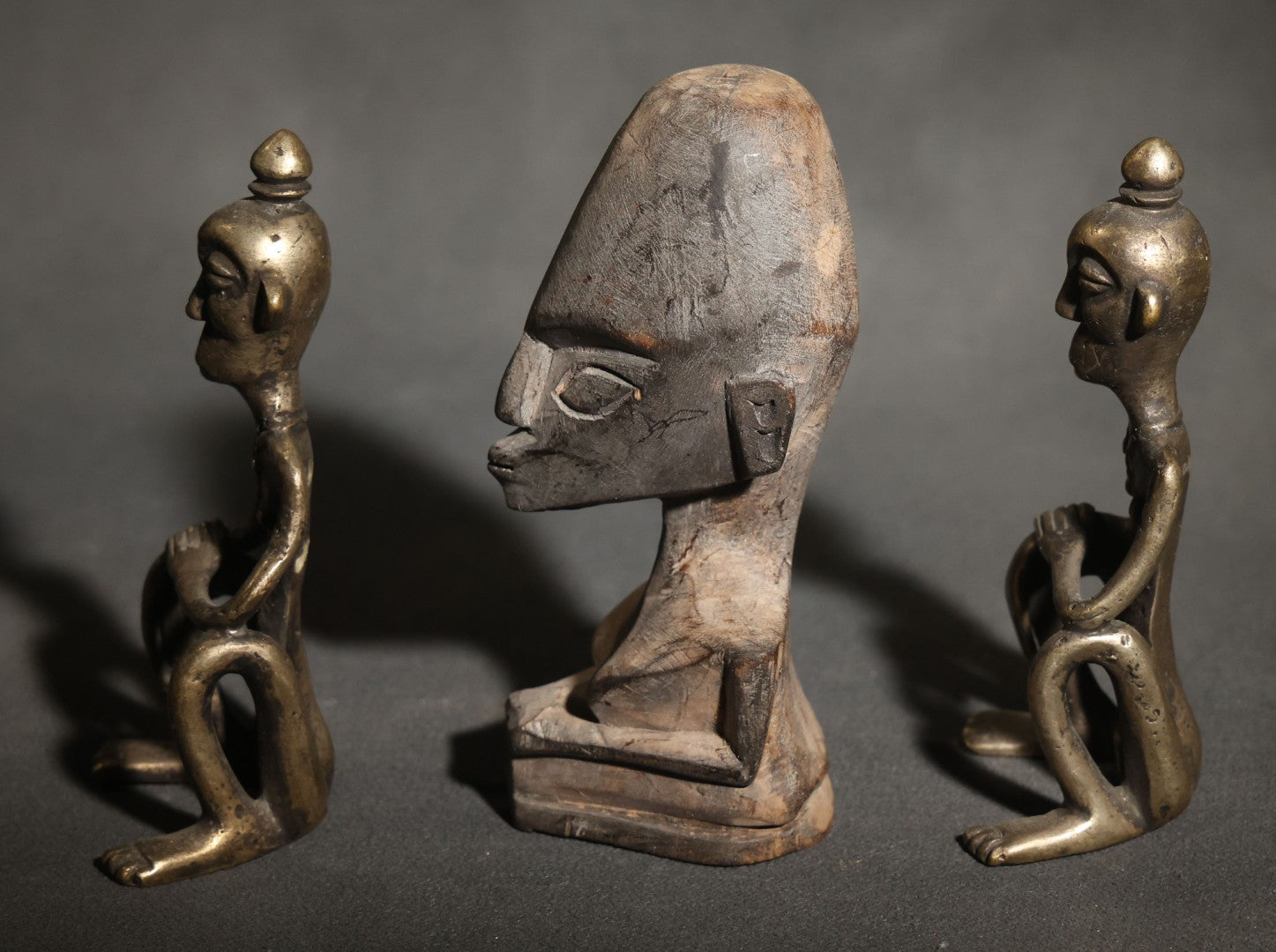 Trio of Vintage African-Style Metal and Wood Figures Including Two Seated Metal Figures and One Carved Wood Bust