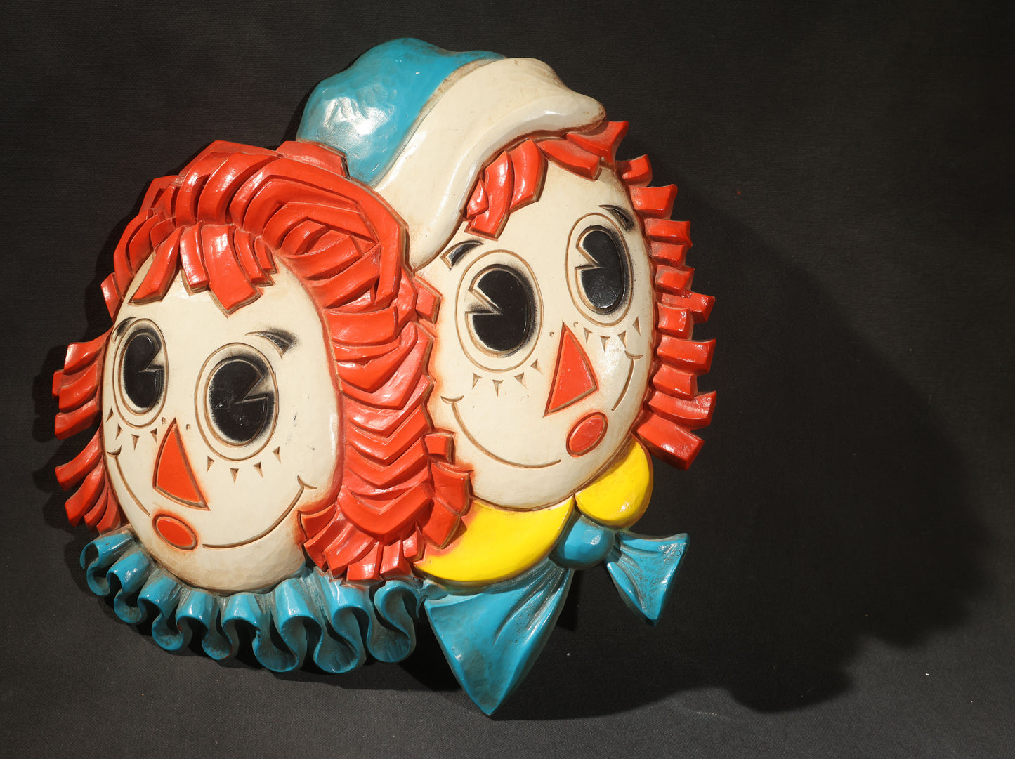 Grouping of Five Vintage Raggedy Ann and Andy Items Including Two Cloth Dolls, 24" L Each, and Three 1970s Plastic Wall Hangings by Dart Industries, Bobbs-Merrill Company Copyright