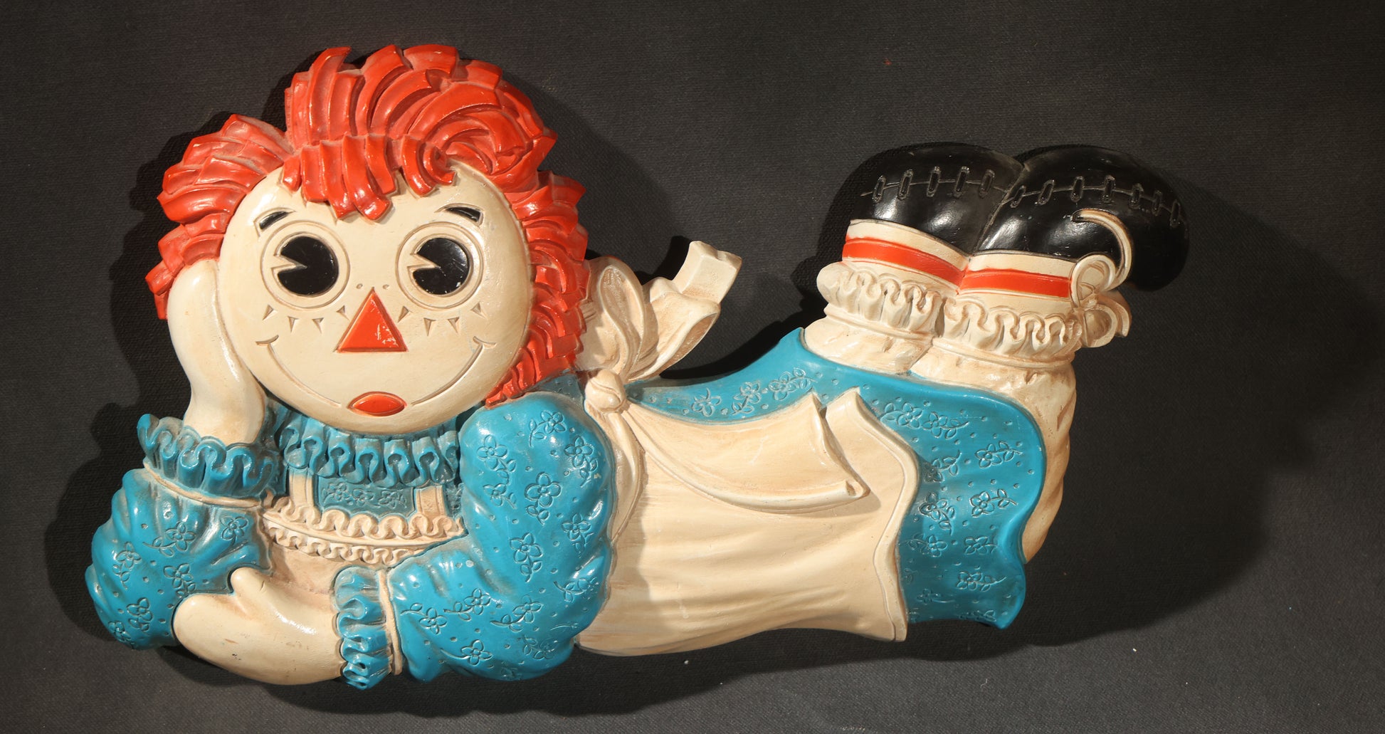 Grouping of Five Vintage Raggedy Ann and Andy Items Including Two Cloth Dolls, 24" L Each, and Three 1970s Plastic Wall Hangings by Dart Industries, Bobbs-Merrill Company Copyright