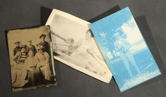 Trio of Antique and Vintage Photographs Including a Cyanotype of a Man Holding a Folding Camera, a Tintype of a Group of Six Young Men and Women, and a Snapshot of a Woman Rowing a Boat with a Dog