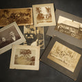 Lot 134 - Grouping of Seven Antique Board-Mounted Photographs Including a Church, Street Scene, Couple's Portrait, Family Gathering, School Group, Early Automobile, and Parlor Interior with Telephone
