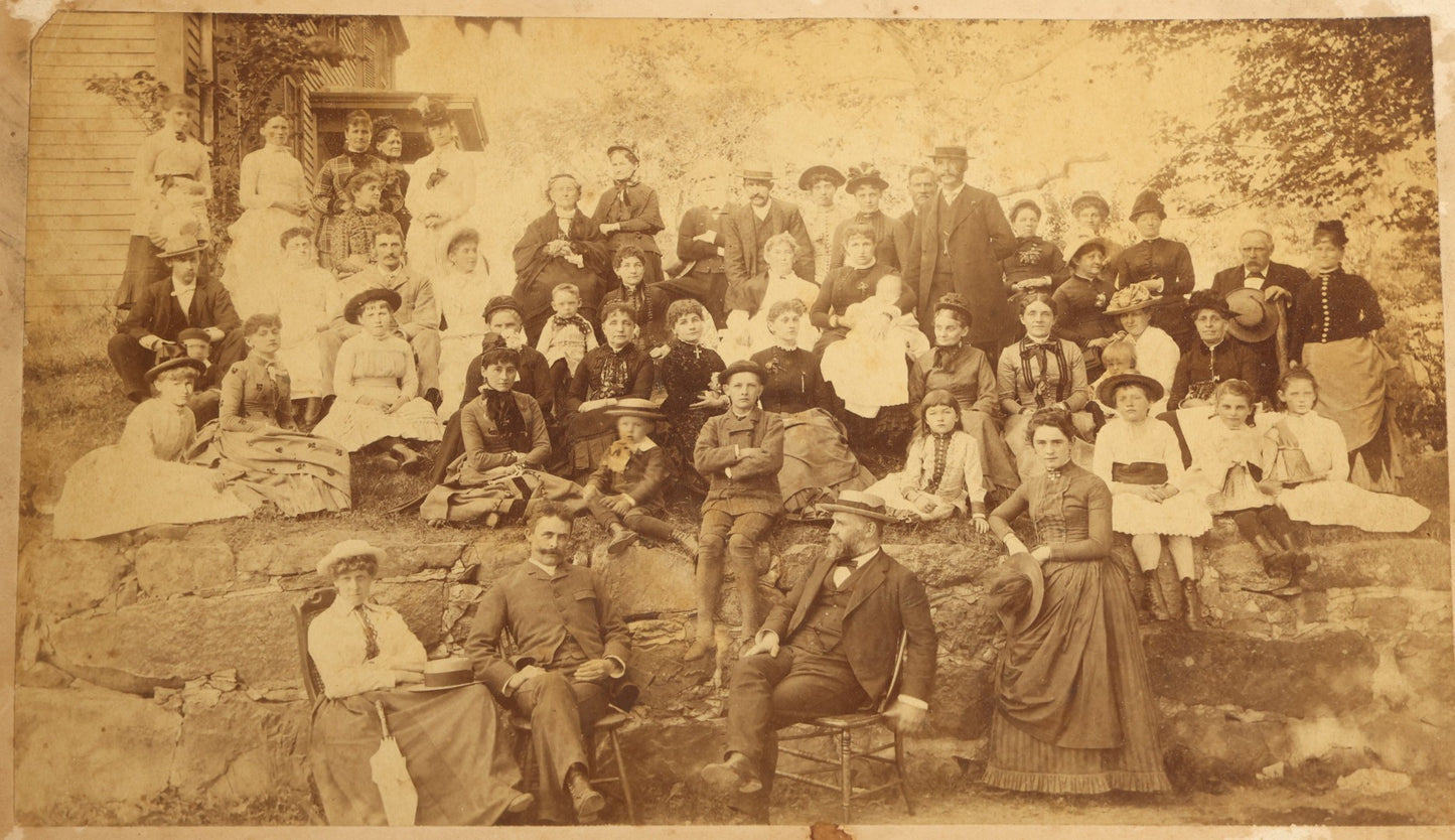 Grouping of Seven Antique Board-Mounted Photographs Including a Church, Street Scene, Couple's Portrait, Family Gathering, School Group, Early Automobile, and Parlor Interior with Telephone