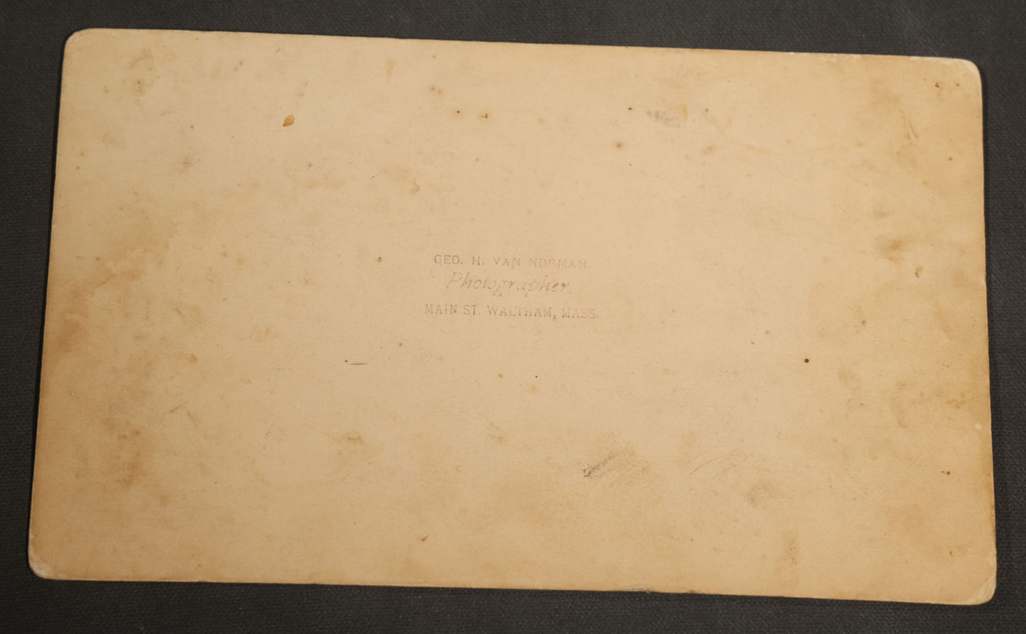 Grouping of Seven Antique Board-Mounted Photographs Including a Church, Street Scene, Couple's Portrait, Family Gathering, School Group, Early Automobile, and Parlor Interior with Telephone