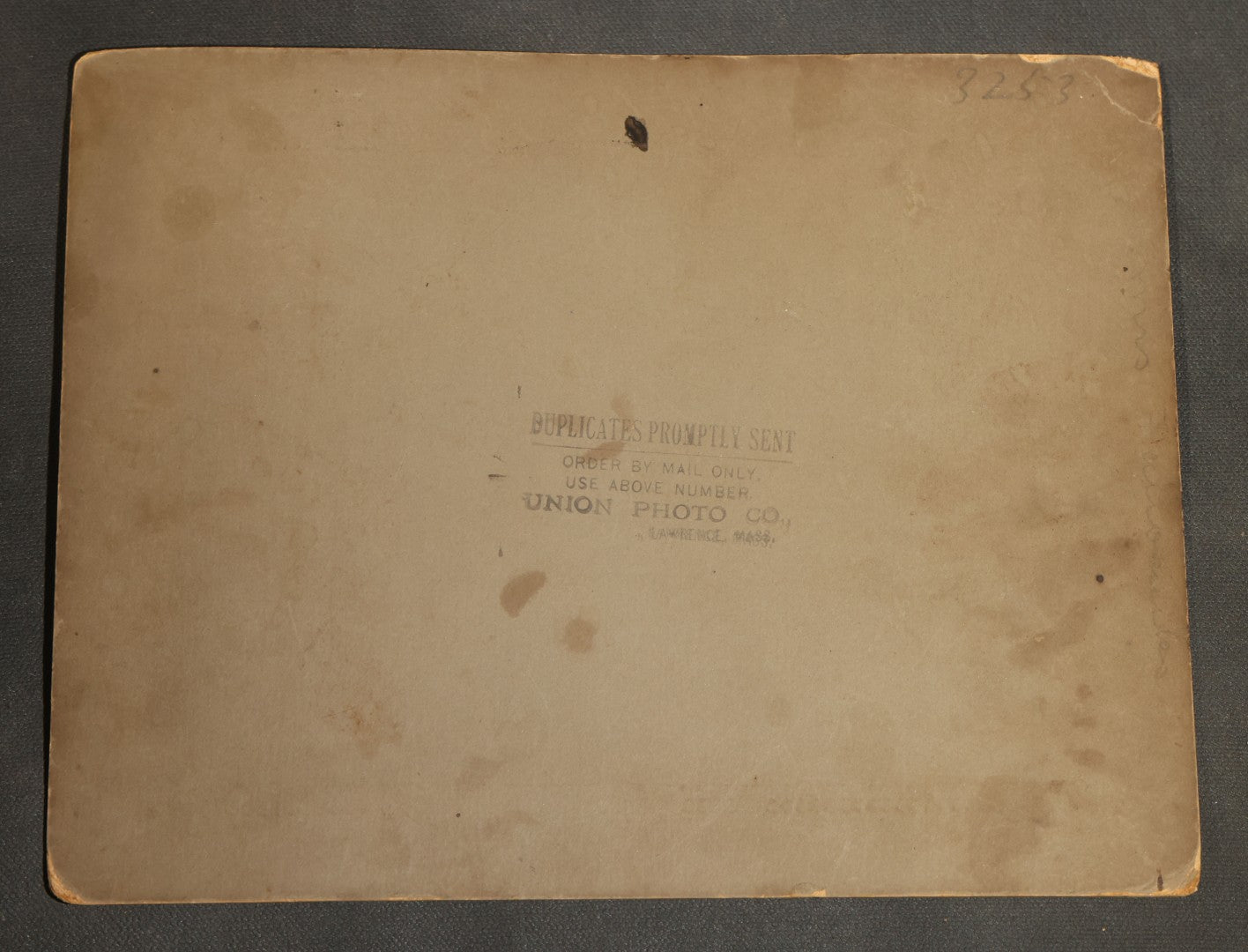 Grouping of Seven Antique Board-Mounted Photographs Including a Church, Street Scene, Couple's Portrait, Family Gathering, School Group, Early Automobile, and Parlor Interior with Telephone