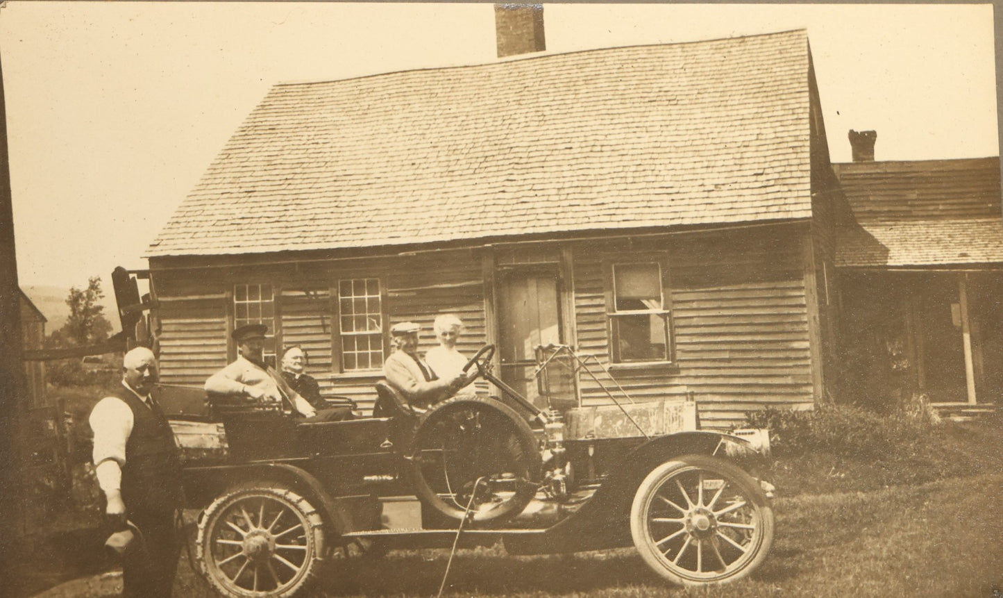 Grouping of Seven Antique Board-Mounted Photographs Including a Church, Street Scene, Couple's Portrait, Family Gathering, School Group, Early Automobile, and Parlor Interior with Telephone