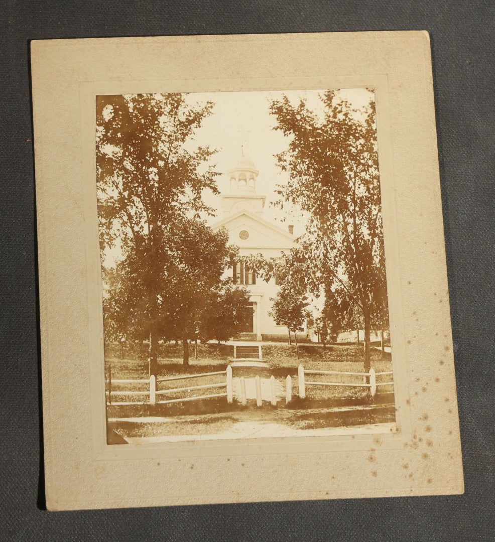 Grouping of Seven Antique Board-Mounted Photographs Including a Church, Street Scene, Couple's Portrait, Family Gathering, School Group, Early Automobile, and Parlor Interior with Telephone
