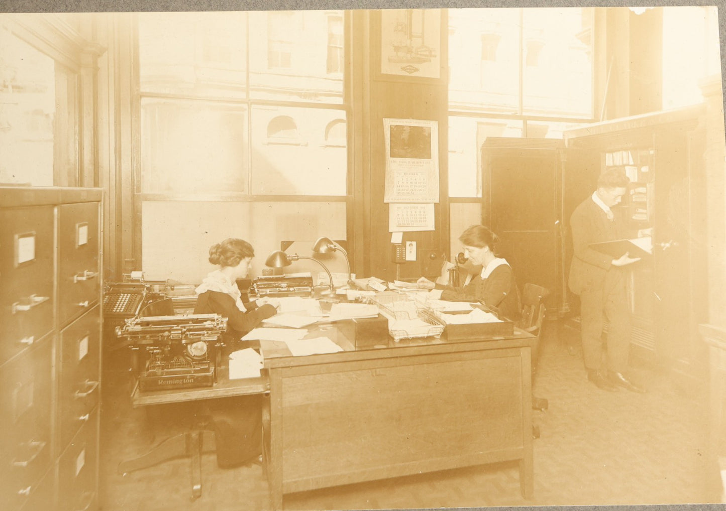 Trio of Antique Board-Mounted Occupational Photographs of Office Interiors with Typewriters, Filing Cabinets, Desks, and Telephones