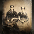 Lot 120 - Antique Full Plate Tintype Photograph of Two Seated Women in Dark Dresses with Plaid Bows