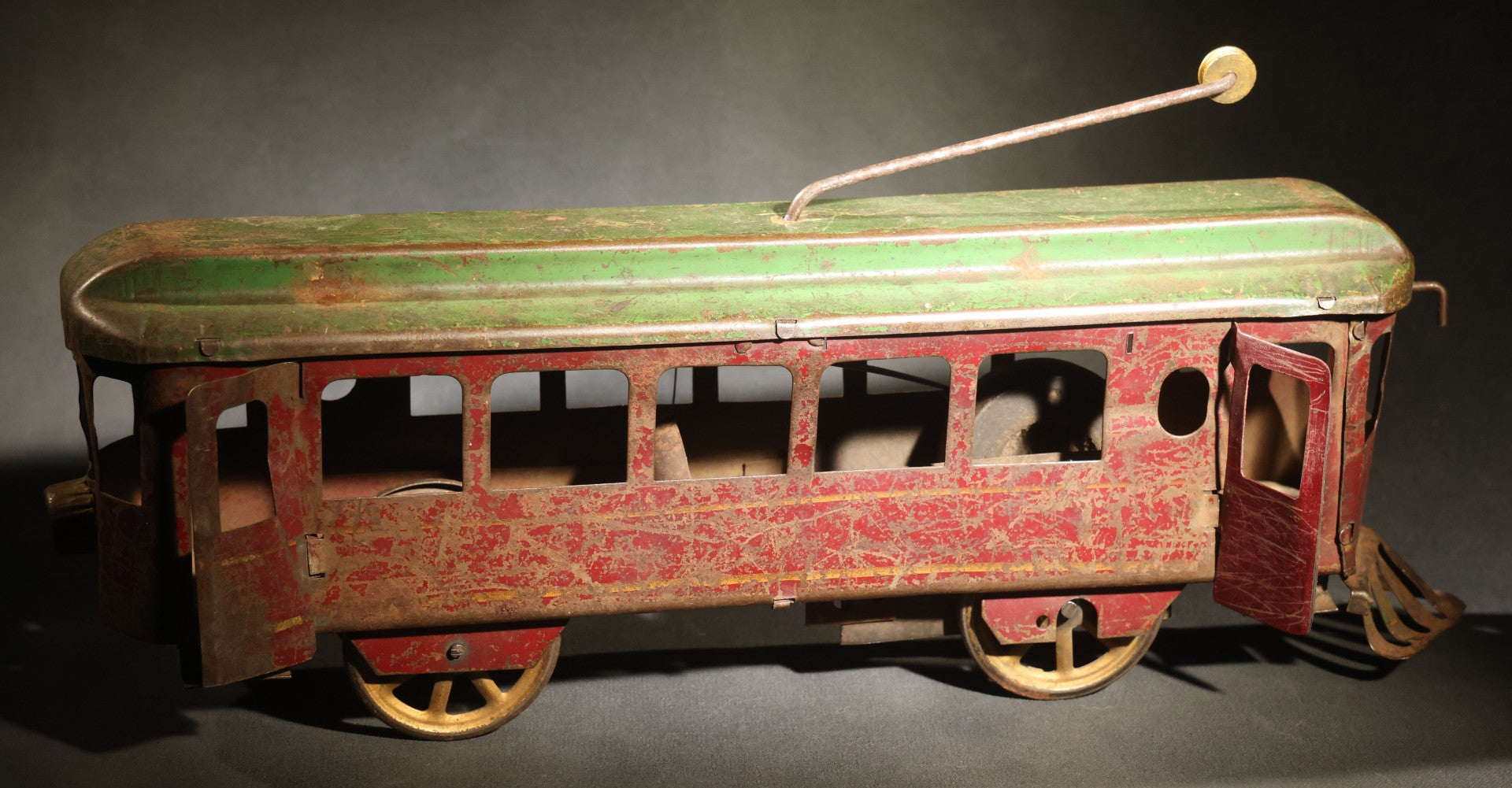Antique Pressed Steel Hill Climber Trolley Car, Likely by Schieble Toy & Novelty Co., Dayton, Ohio, Circa 1910, Red and Green with Trolley Pole and Cow Catcher