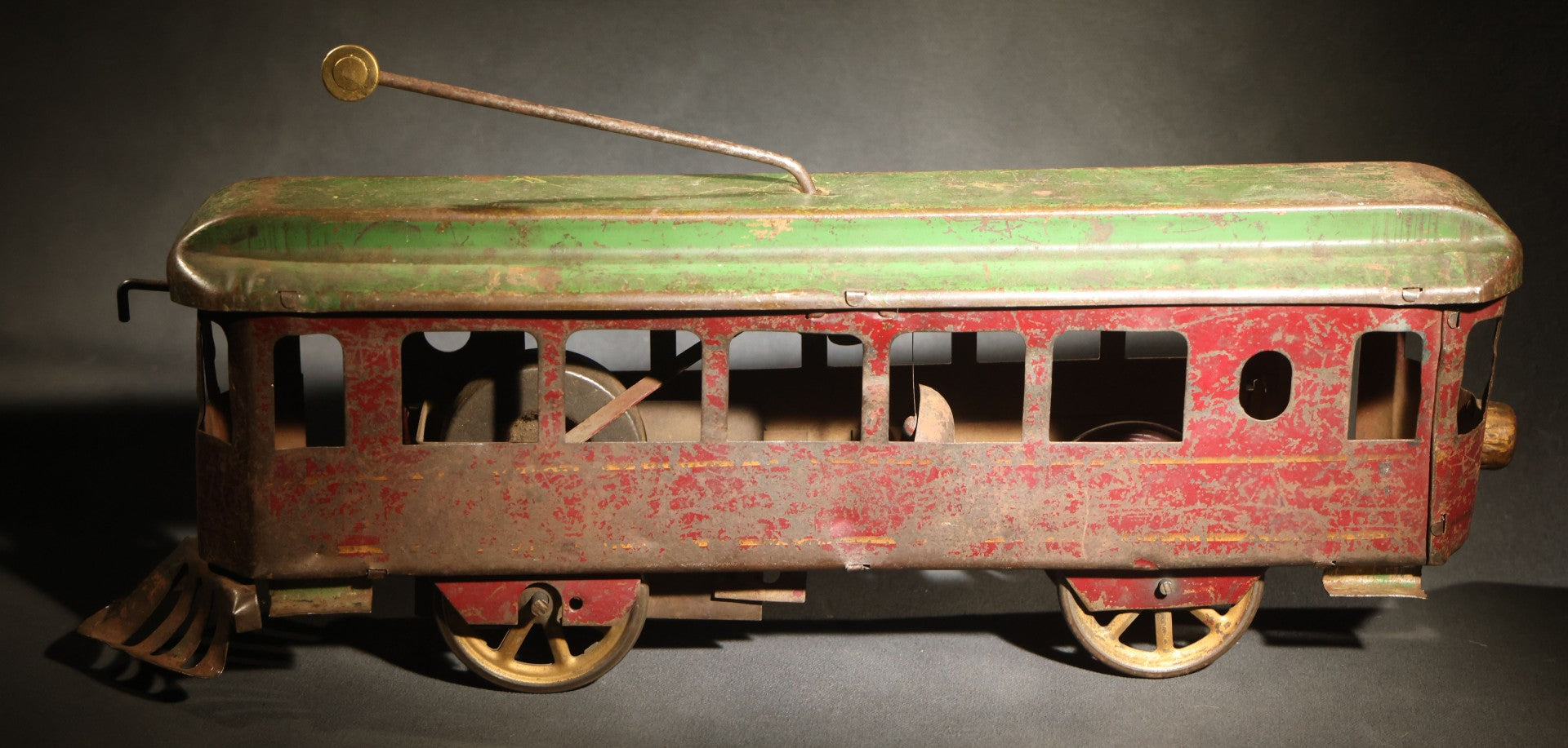 Antique Pressed Steel Hill Climber Trolley Car, Likely by Schieble Toy & Novelty Co., Dayton, Ohio, Circa 1910, Red and Green with Trolley Pole and Cow Catcher