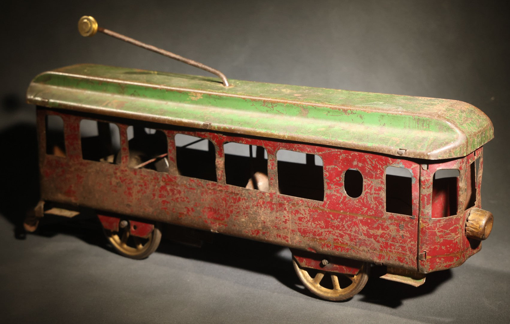 Antique Pressed Steel Hill Climber Trolley Car, Likely by Schieble Toy & Novelty Co., Dayton, Ohio, Circa 1910, Red and Green with Trolley Pole and Cow Catcher