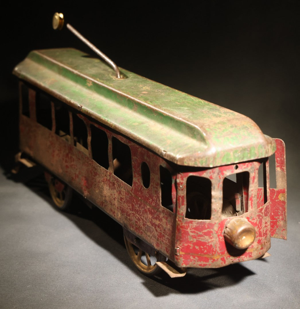Antique Pressed Steel Hill Climber Trolley Car, Likely by Schieble Toy & Novelty Co., Dayton, Ohio, Circa 1910, Red and Green with Trolley Pole and Cow Catcher