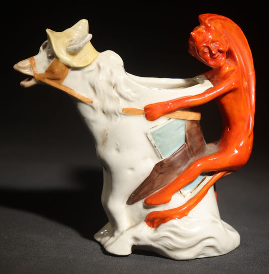 Antique Porcelain Figural Creamer of a Red Devil Riding a White Horse, Likely German, Note Horse Missing Tip of Ear