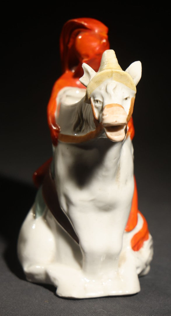 Antique Porcelain Figural Creamer of a Red Devil Riding a White Horse, Likely German, Note Horse Missing Tip of Ear