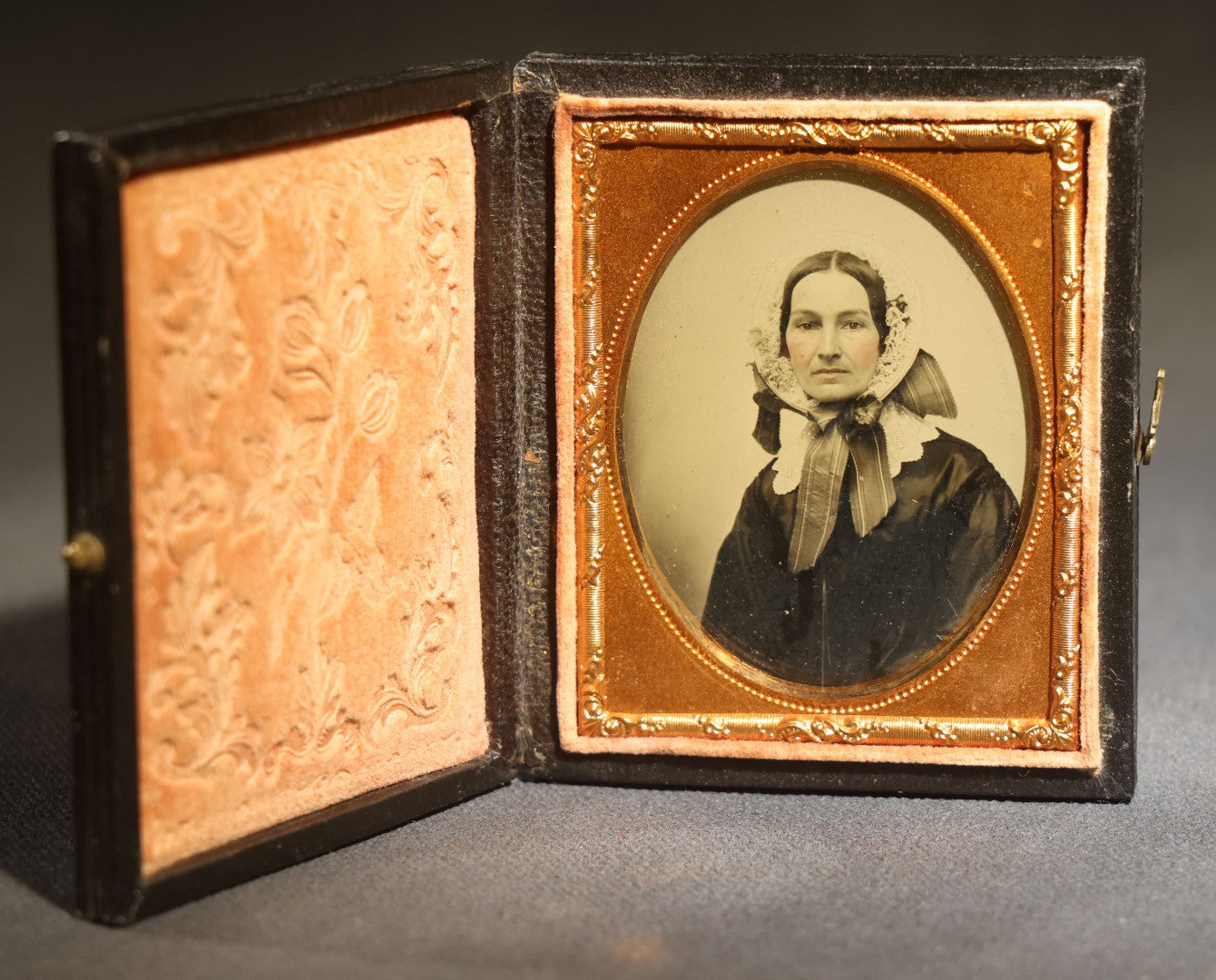 Antique 1/9th Plate Ambrotype Photograph of a Middle-Aged Woman in a Bonnet and Dark Dress, Full Intact Leatherette Case