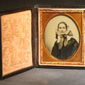 Lot 118 - Antique 1/9th Plate Ambrotype Photograph of a Middle-Aged Woman in a Bonnet and Dark Dress, Full Intact Leatherette Case