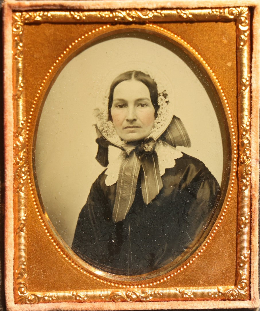 Antique 1/9th Plate Ambrotype Photograph of a Middle-Aged Woman in a Bonnet and Dark Dress, Full Intact Leatherette Case