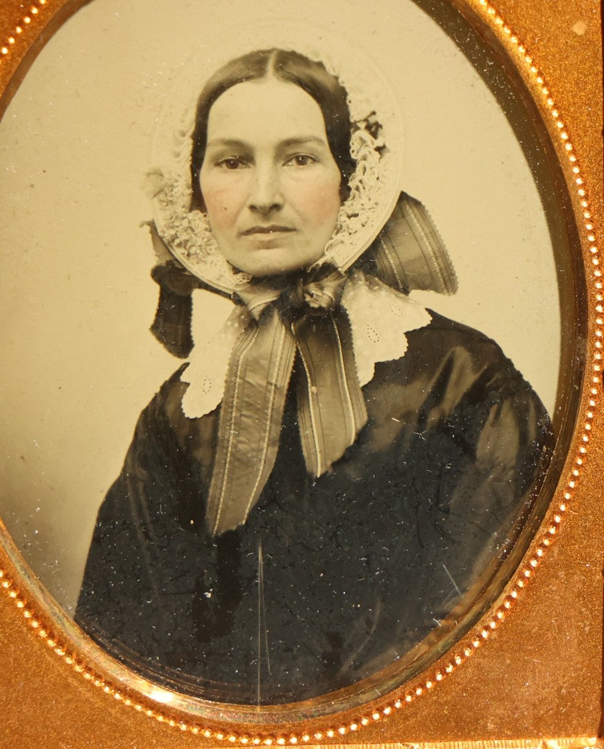 Antique 1/9th Plate Ambrotype Photograph of a Middle-Aged Woman in a Bonnet and Dark Dress, Full Intact Leatherette Case