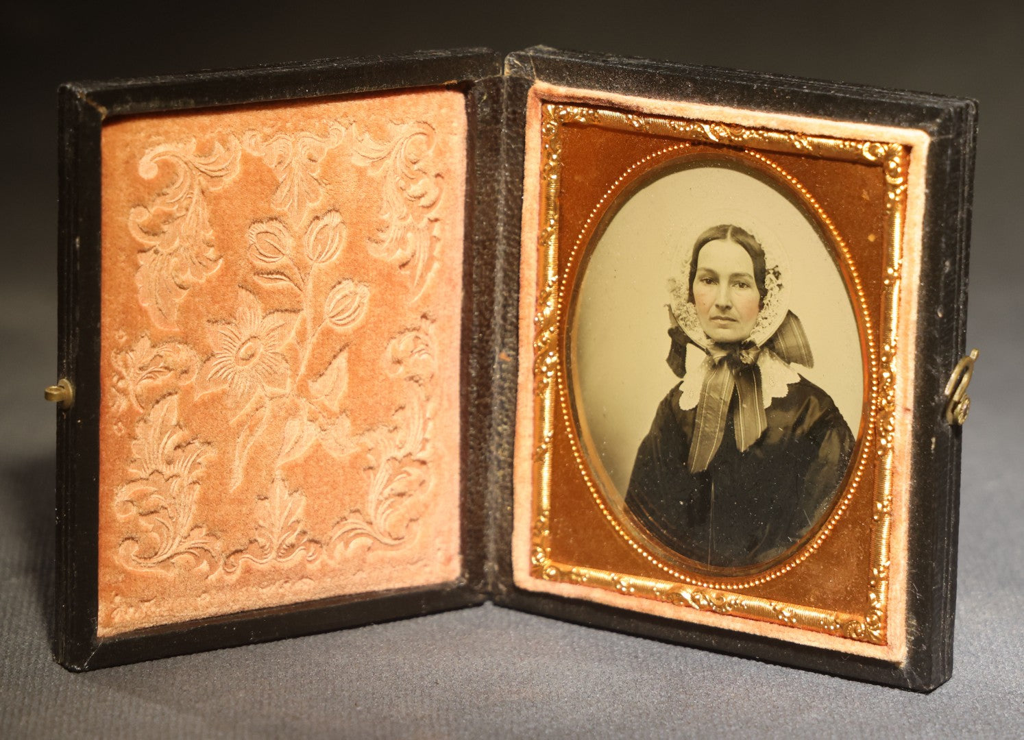 Antique 1/9th Plate Ambrotype Photograph of a Middle-Aged Woman in a Bonnet and Dark Dress, Full Intact Leatherette Case