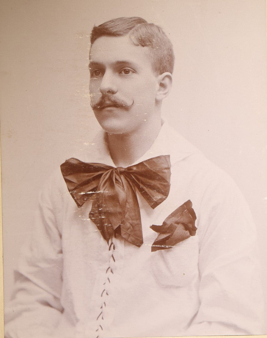 Antique Cabinet Card Photograph of a Man in a Laced White Shirt with a Large Bow, Possible Performer, Photographed by A.A. Baldwin, Rutland, Vermont