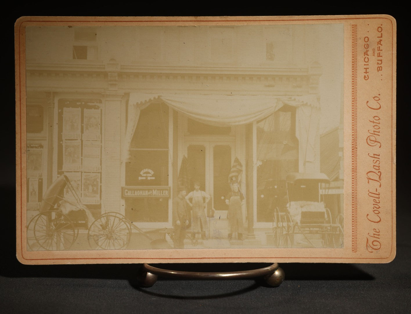 Antique Cabinet Card Occupational Photograph of the Callaghan and Miller Storefront with Horse-Drawn Buggies, Photographed by the Covell-Dash Photo Co., Chicago, Illinois and Buffalo, New York