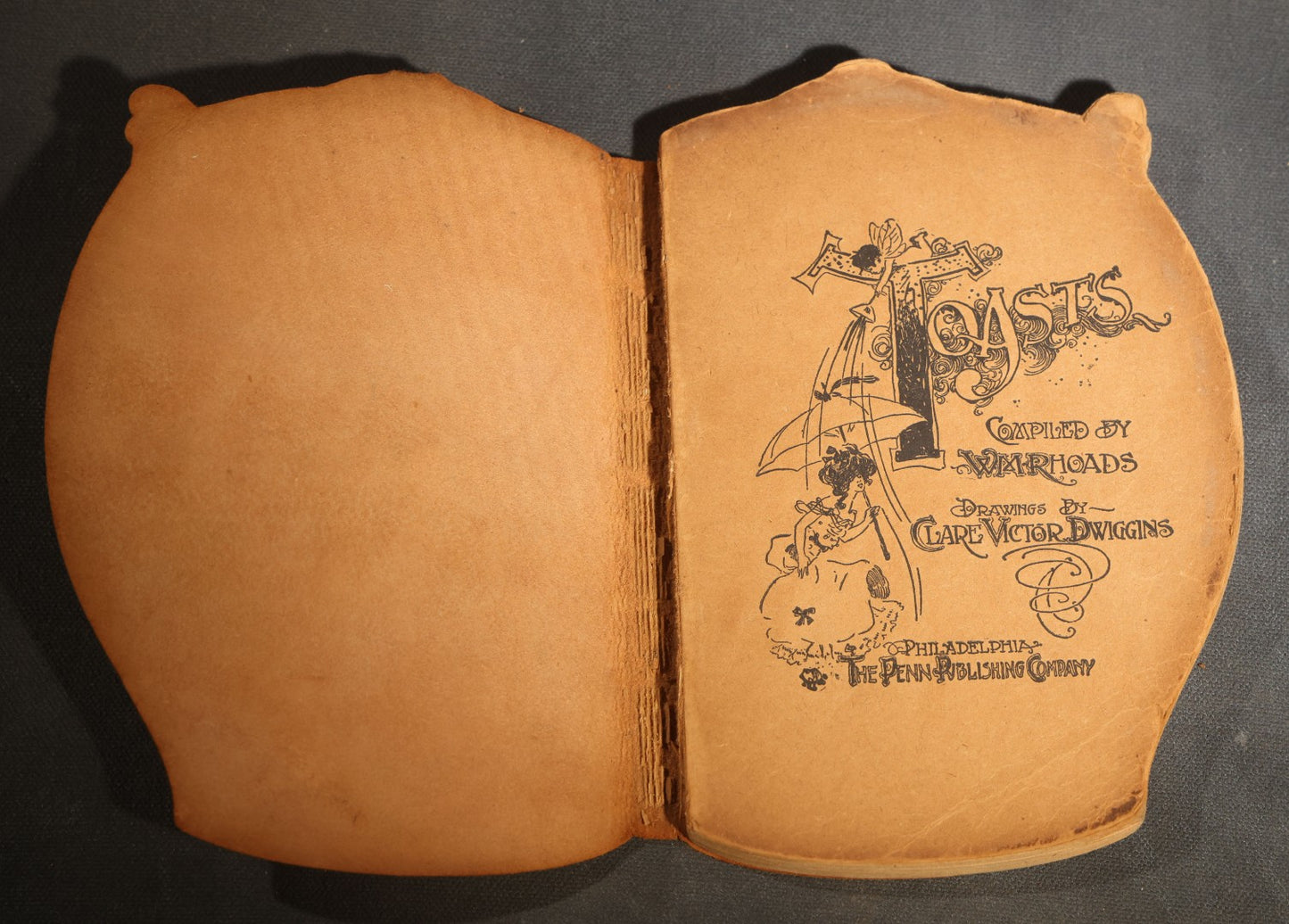 "Toasts" Antique Leather-Covered Stein-Shaped Novelty Book Compiled by W.M. Rhoads, Drawings by Clare Victor Dwiggins, Published by the Penn Publishing Company, Philadelphia, Pennsylvania, 1904