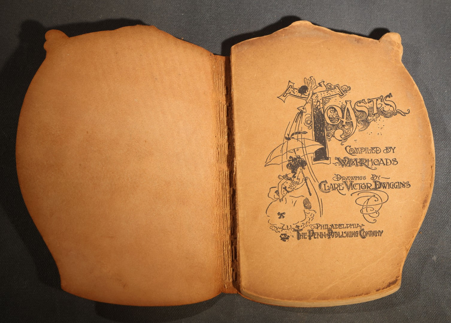 "Toasts" Antique Leather-Covered Stein-Shaped Novelty Book Compiled by W.M. Rhoads, Drawings by Clare Victor Dwiggins, Published by the Penn Publishing Company, Philadelphia, Pennsylvania, 1904