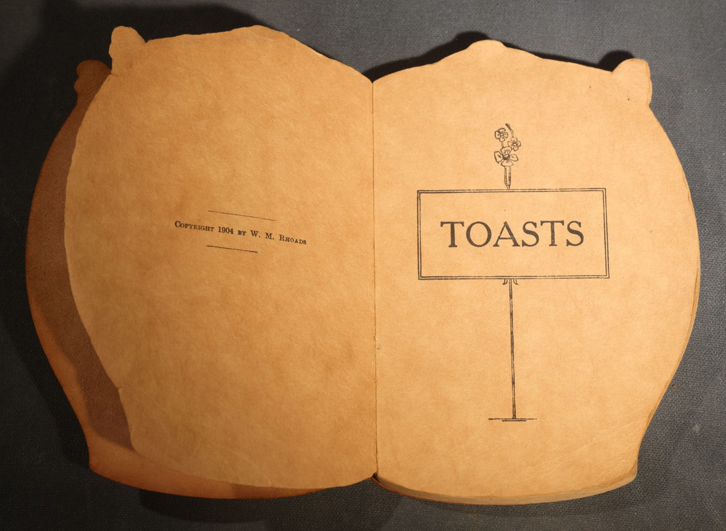 "Toasts" Antique Leather-Covered Stein-Shaped Novelty Book Compiled by W.M. Rhoads, Drawings by Clare Victor Dwiggins, Published by the Penn Publishing Company, Philadelphia, Pennsylvania, 1904