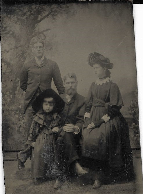 Tintype Photograph of Two Men, A Toung Woman, and a Child