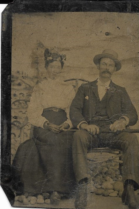 Tintype Photograph of a Seated Woman with a Man in a Hat with a Great Mustache