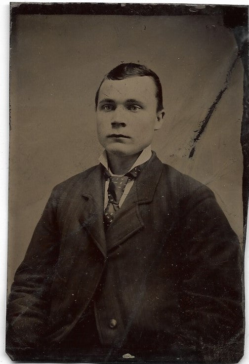 Tintype Photograph of a Solemn Looking Young Man
