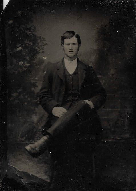 Tintype Photograph of a Man with a Comb-over and Crossed Legs