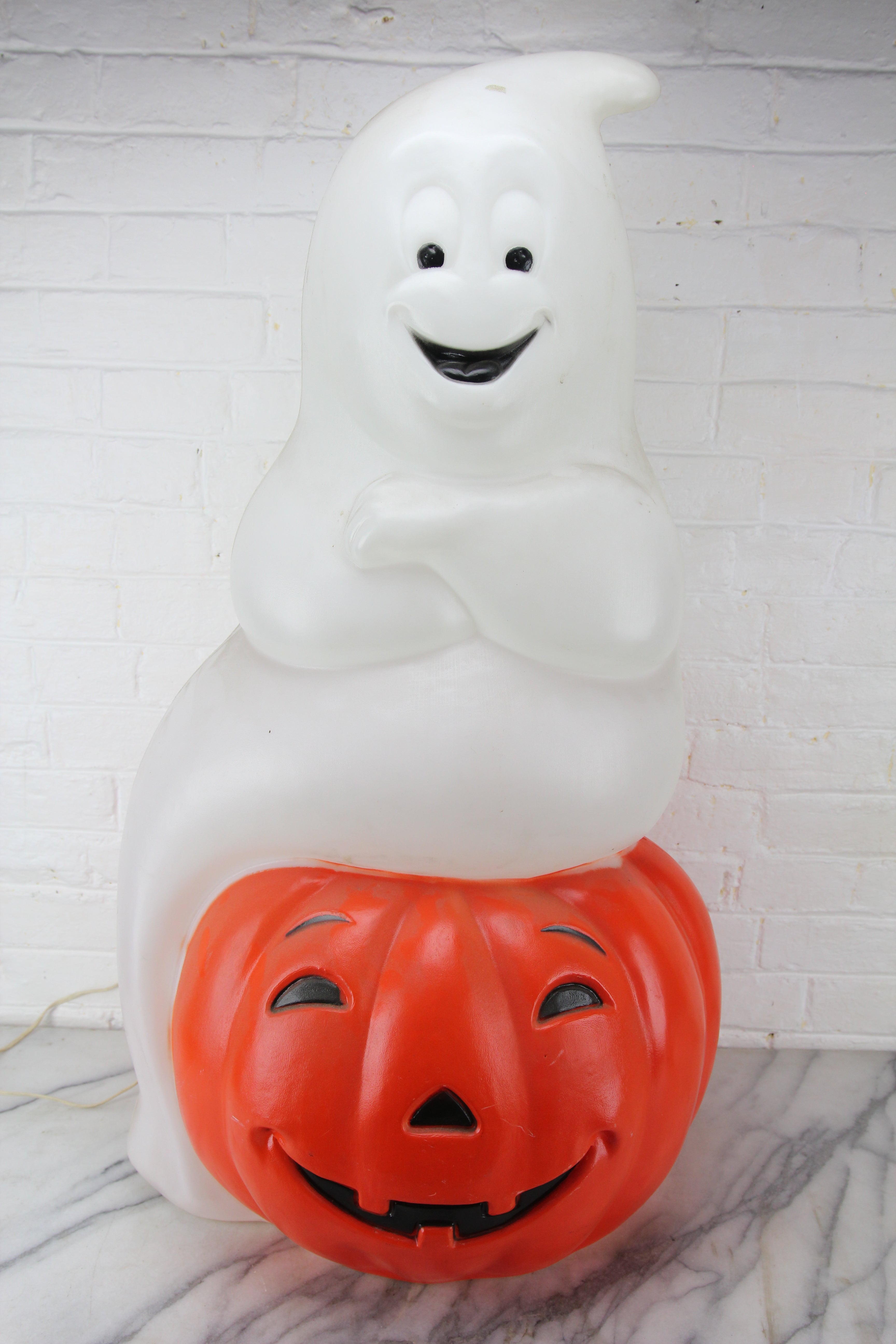 Vintage halloween pumpkin on store stand blowmold