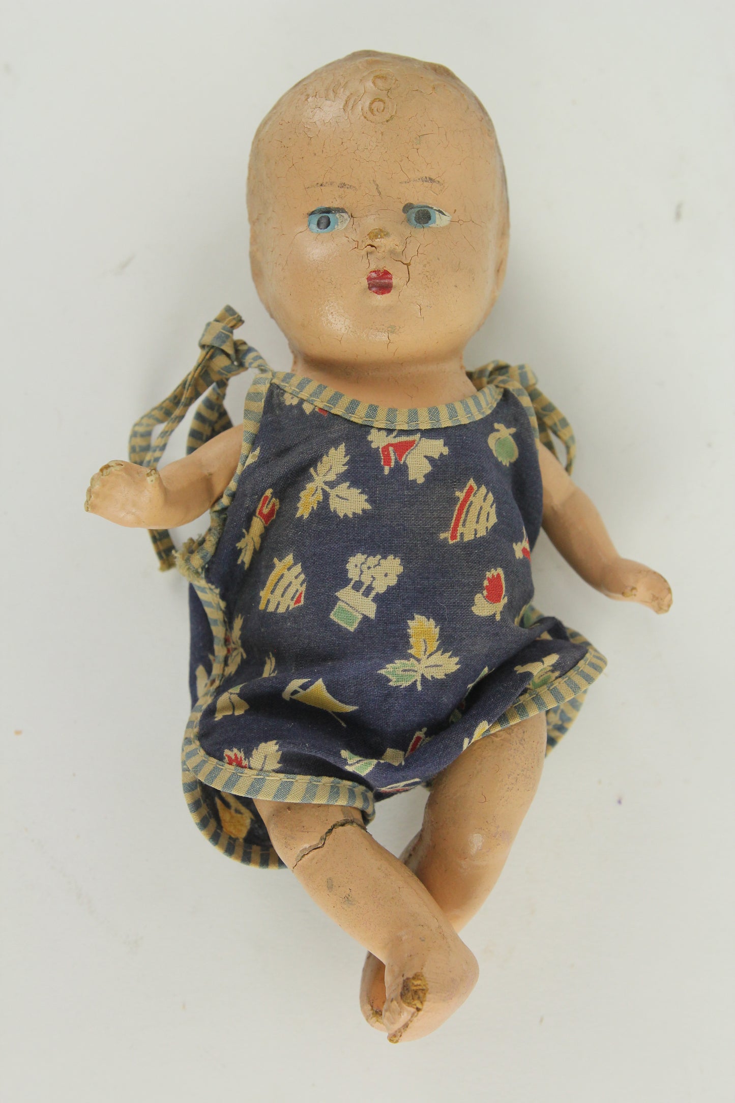 Small Size Composition Baby Doll with Blue Eyes and a Blue Onesie, 9"