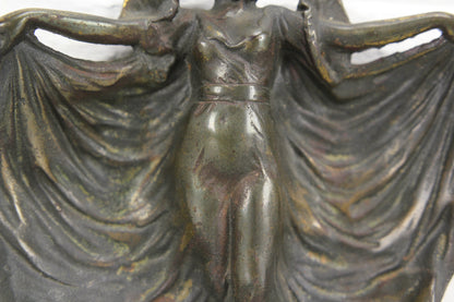 Heavy Metal Ring Dish With a Woman Holding Up Her Dress