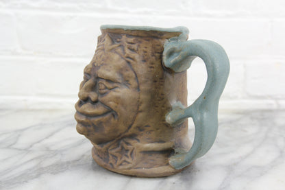 Jim Rumph Ceramic Troll Face Mug with Creepy Frog Inside