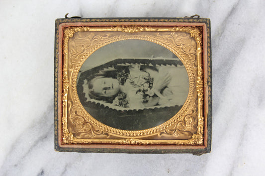 Postmortem Ambrotype Photograph of a Young Girl in Her Coffin with Flowers, 1/6th Plate