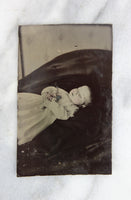 Postmortem Tintype Photograph of a Baby with Flowers in Repose