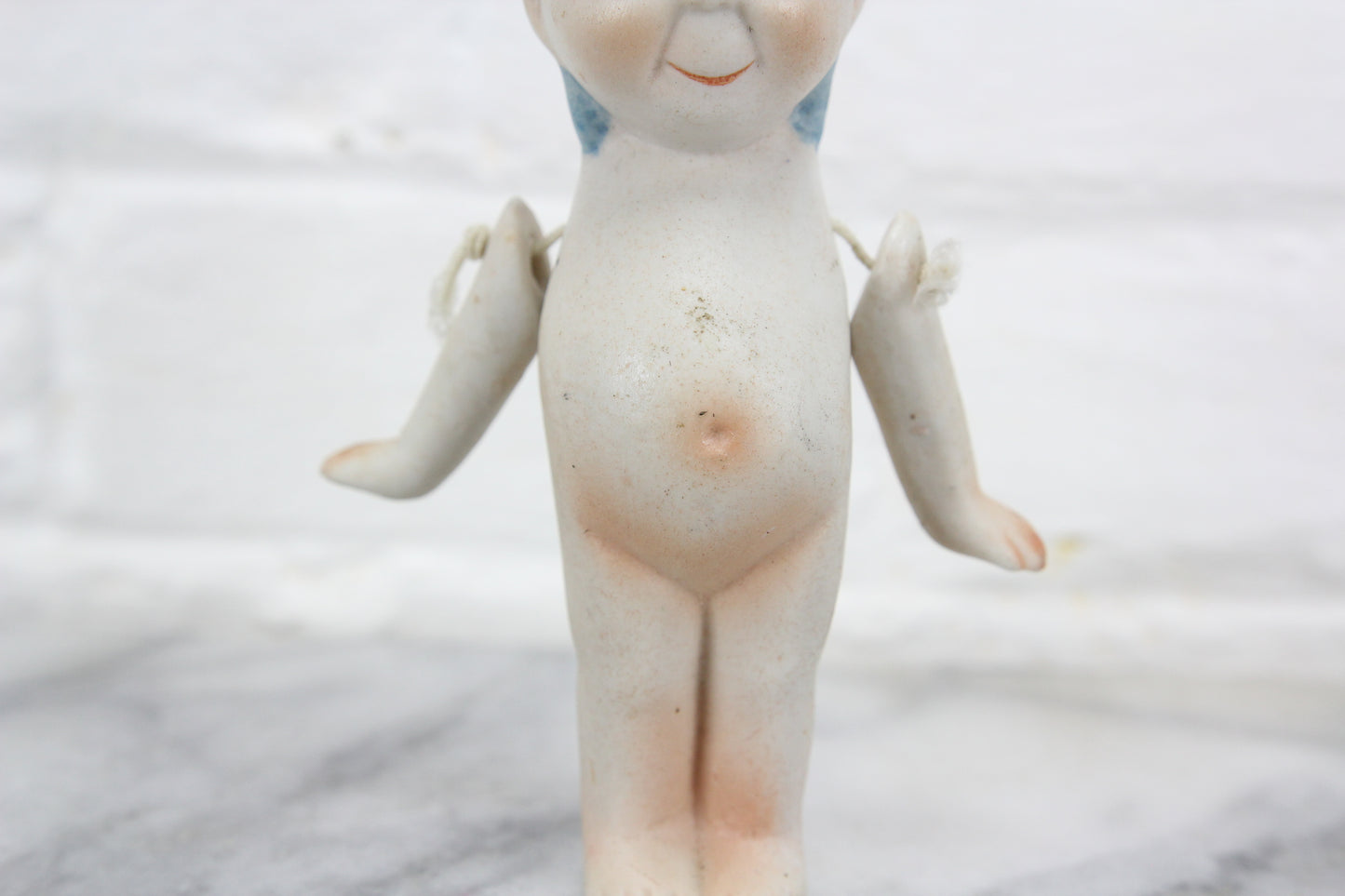 Bisque Rose O'Neill Kewpie Doll with Corded Arms, 5"