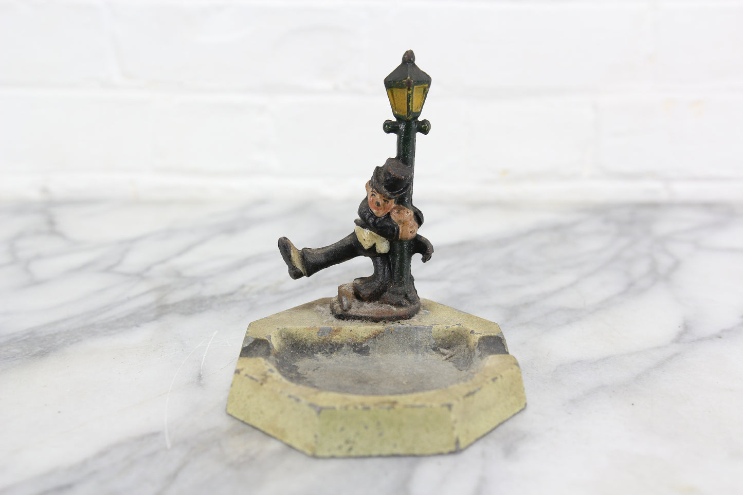 Die Cast Metal Ashtray with Drunk Man Hanging on Lamp Post, John Wright
